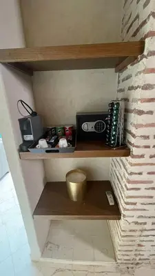 a shelf in a room with a radio on it at RIAD LUXE LOCATION le GRIZZLY in Marrakech