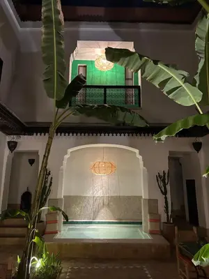a room with a pool in a building at Riad Dar Balthazar in Marrakech