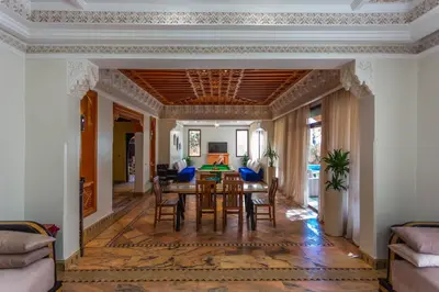 a dining room with a table and chairs at Villa Dahlia in Marrakech