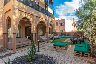a house with a courtyard with a pool at Villa Dahlia in Marrakech