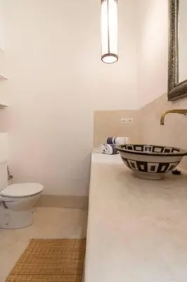 a bathroom with a sink and a toilet at DAR SAFIRA in Marrakech