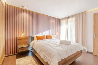 a bedroom with a large bed and a large window at Design, résidence standing, Salon modern, Terrasse in Marrakech