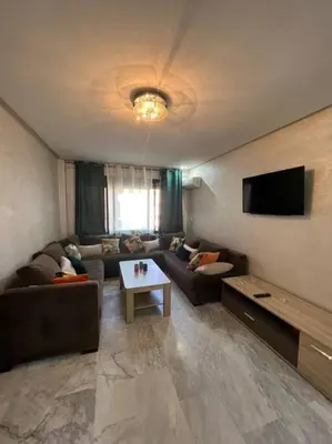 a living room with a couch and a table at Vitality Harmony A27 in Marrakech