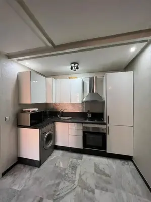 a large kitchen with a stove and a sink at Vitality Harmony A27 in Marrakech