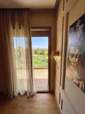 a hallway with a door with a view of a window at Garden Marrakech Luxury in Marrakech