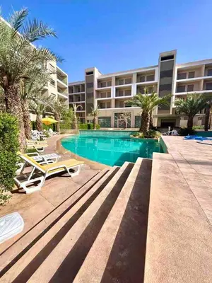 a resort with a swimming pool and a building at Garden Marrakech Luxury in Marrakech