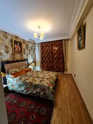 a bedroom with a bed and a red rug at 1 Bed Flat - Sleeps 2 - Parking - Wifi in Marrakech