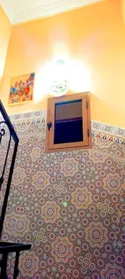 a tv on the wall in a room at Oasis appart sérénité in Marrakech