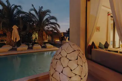 a hotel with a swimming pool and a resort at Les Jardins de Kesali By La Siredrah in Marrakech