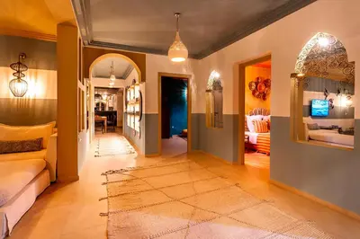 a living room with a couch and a rug at LES TANNEURS PENTHOUSE MARRAKECH in Marrakech