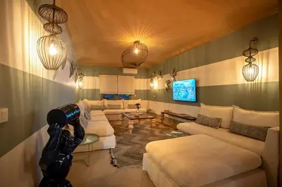 a living room with couches and a camera at LES TANNEURS PENTHOUSE MARRAKECH in Marrakech