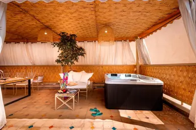 a large room with a tub in a tent at LES TANNEURS PENTHOUSE MARRAKECH in Marrakech