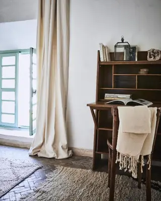 an office with a desk and a chair and a window at Riad Kitula in Marrakech