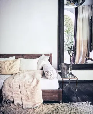 a bedroom with a bed and a table at Riad Kitula in Marrakech