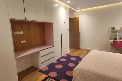 a bedroom with a bed and a polka dot rug at Villa moderne avenue M6 in Marrakech
