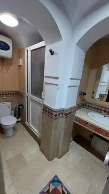 a bathroom with a shower and a toilet and a sink at Cosy apartment in Marrakesh, Guliz in Marrakech