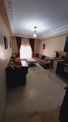 a living room with couches and a table at Cosy apartment in Marrakesh, Guliz in Marrakech