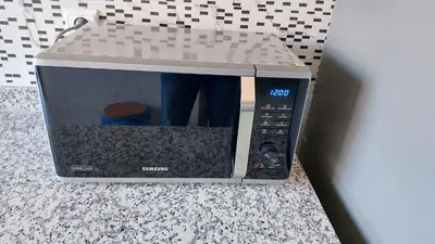 a microwave oven with its door open on a counter at New Apartment in Marrakesh Guliz in Marrakech