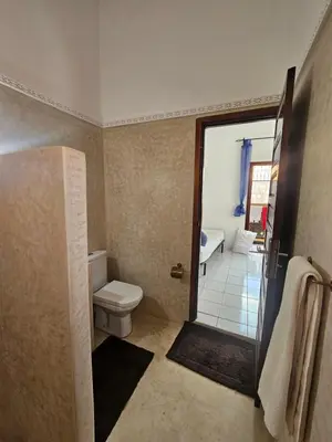 a bathroom with a toilet and a shower at Riad Latifa in Marrakech