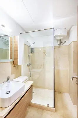 a bathroom with a sink and a shower at Royal Deluxe Platinum - Marrakech, Luxe Pool View in Marrakech