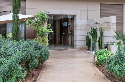 an entrance to a building with plants at Royal Deluxe Platinum - Marrakech, Luxe Pool View in Marrakech
