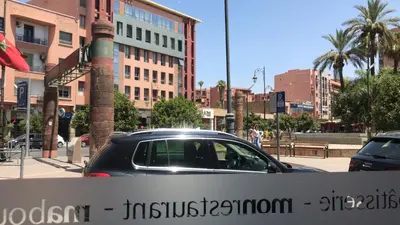 a car parked on a street in a city at Central Marrakech Stay Bright & Airy with Scenic Gueliz location in Marrakech