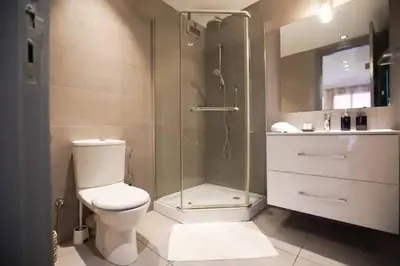 a bathroom with a shower and a toilet and a sink at Charming Cozy 2 Bedrooms central Gueliz in Marrakech