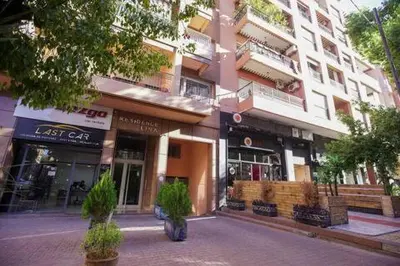 a street in front of a large building at Charming Cozy 2 Bedrooms central Gueliz in Marrakech