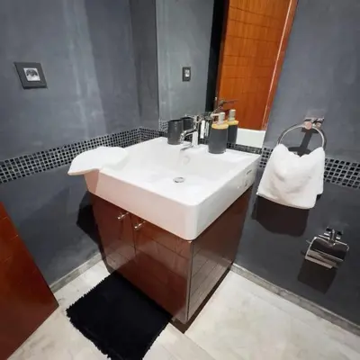 a bathroom with a white sink and a mirror at Chic Hideaway - Marrakech Centre in Marrakech