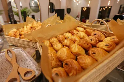 a bunch of pastries in baskets on a table at Ari Boutique Hôtel - Adult Only in Marrakech